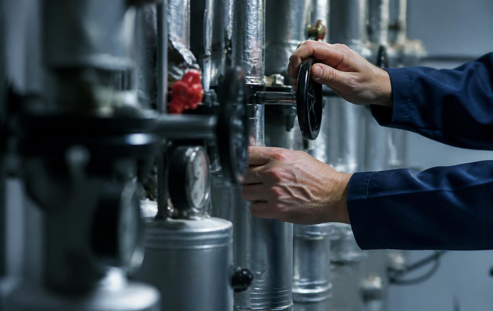 Facilities engineer inspecting building services